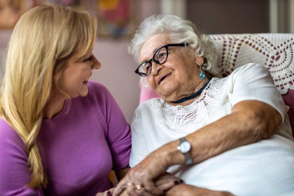 Elderly lady with younger female caregiver