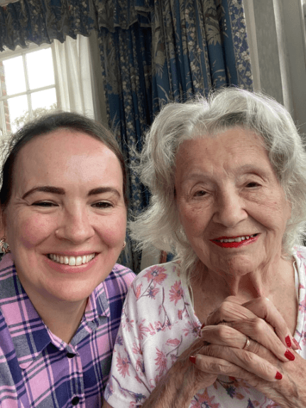 Caregiver Ruby smiles at the camera, beside client Ruby.