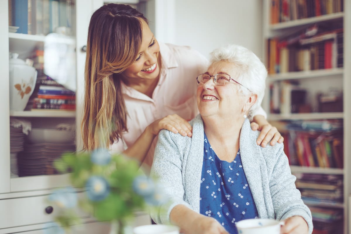 Elderly lady being reassured and receiving support