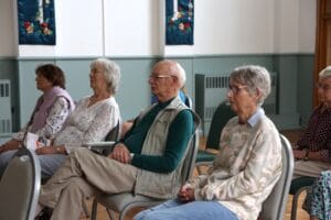 Attendees at our recent dementia action week event listening to a talk from our learning and development manager.