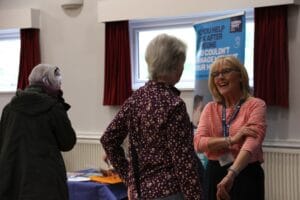 Attendees chatting at our recent dementia information market place event