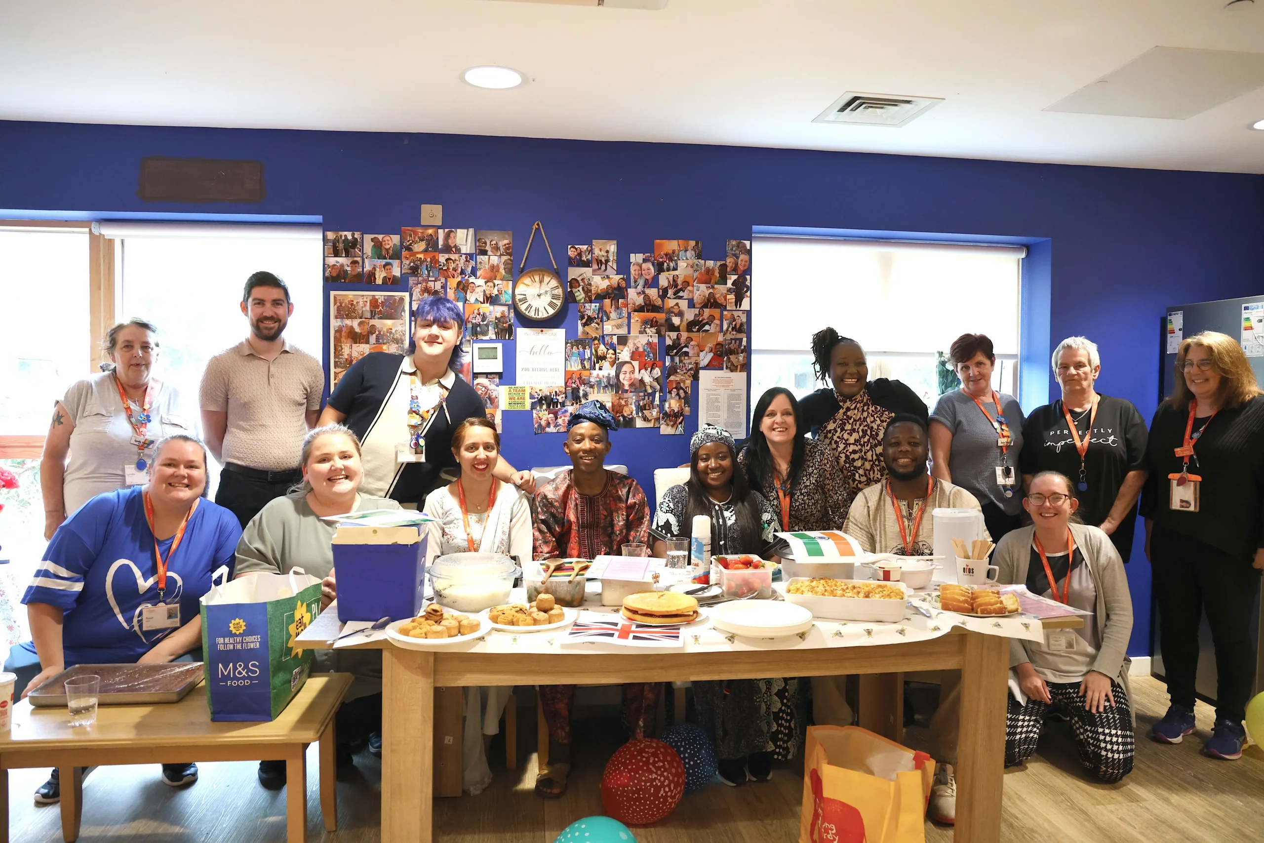 A group photo of some of the Unique Senior Care team celebrating at their Culture Day