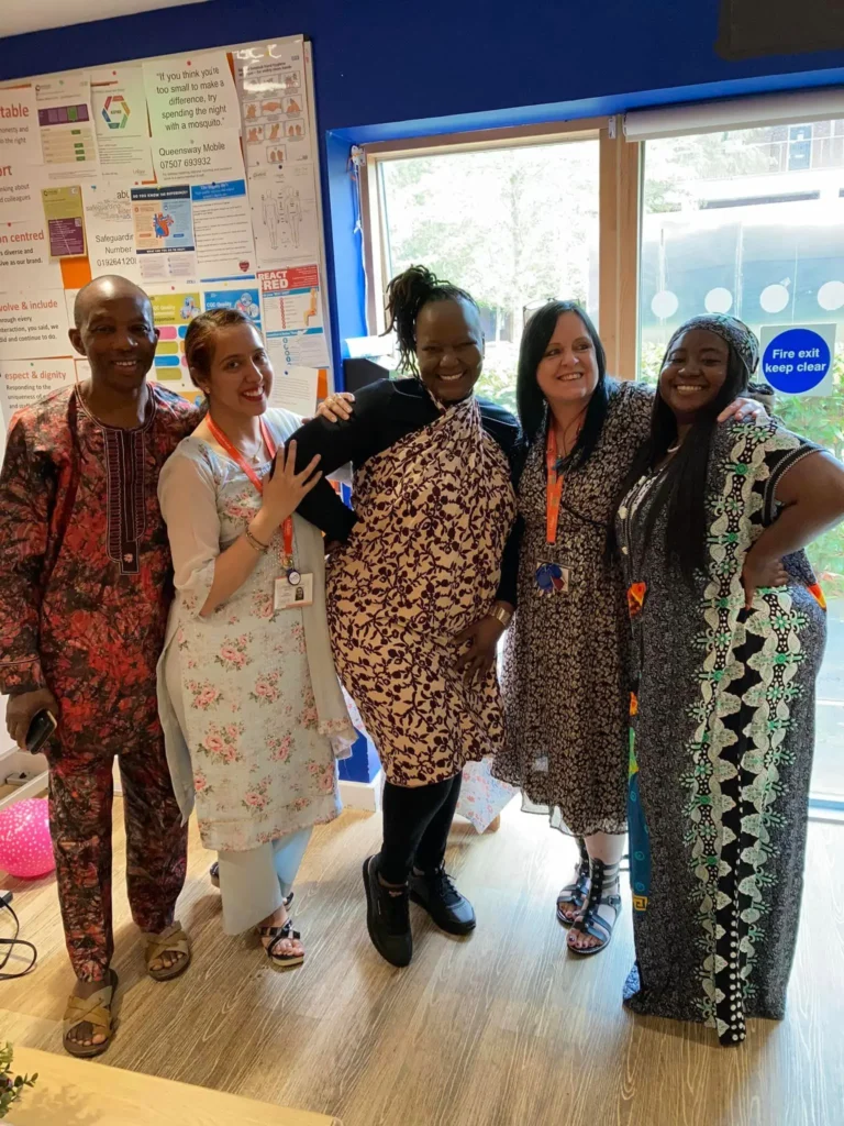 Some of the team smiling together for a group picture at Queensway Court's culture day