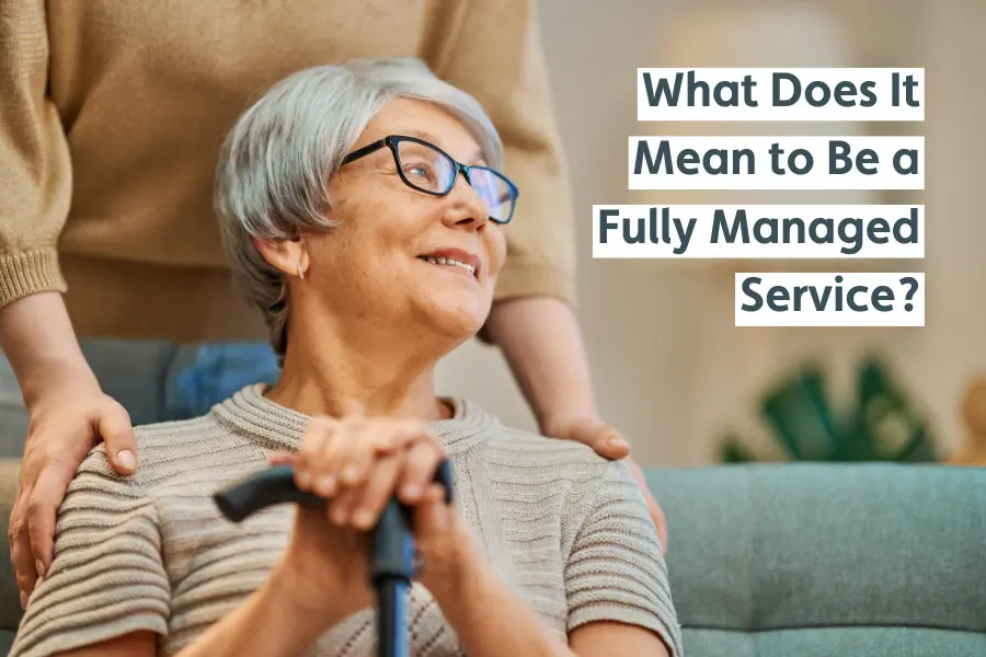 Elderly woman smiling while being supported by a carer, with text reading "What Does It Mean to Be a Fully Managed Service?"