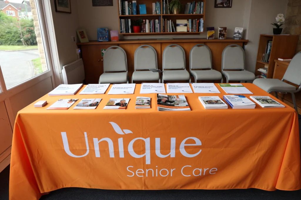 A group of leaflets displayed on a table at the family dementia workshop